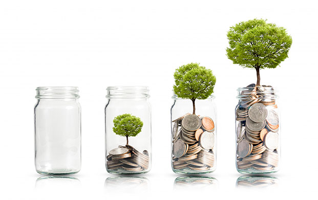 Four glass jars contain larger amounts of coins and a larger tree to suggest more savings.