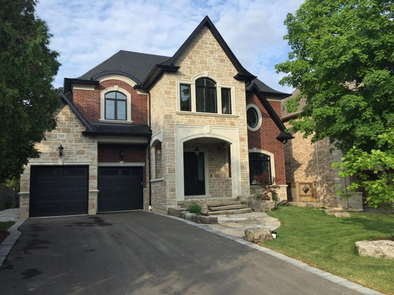 Exterior of a modern home with black window frames