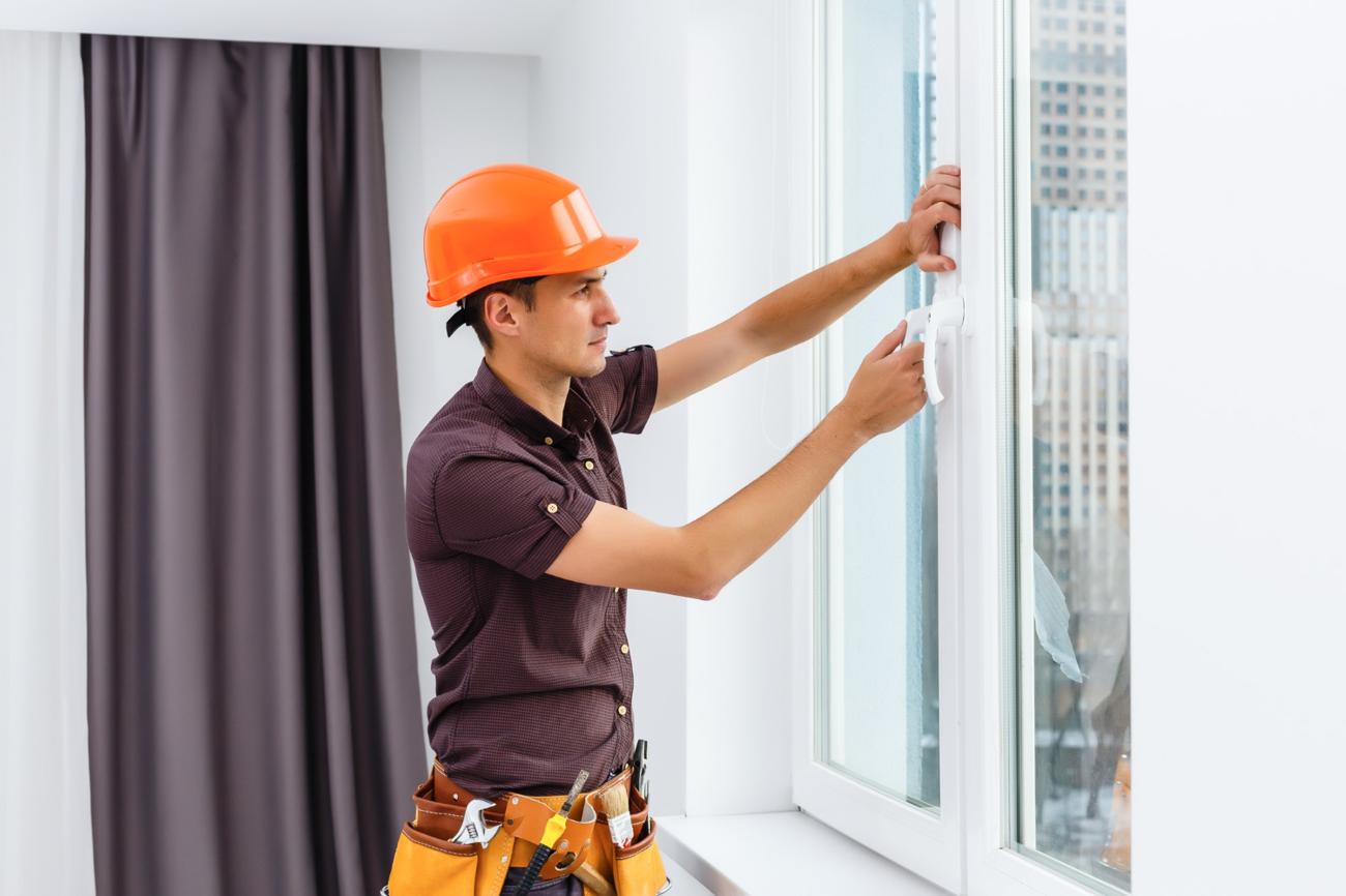 Man installing a window