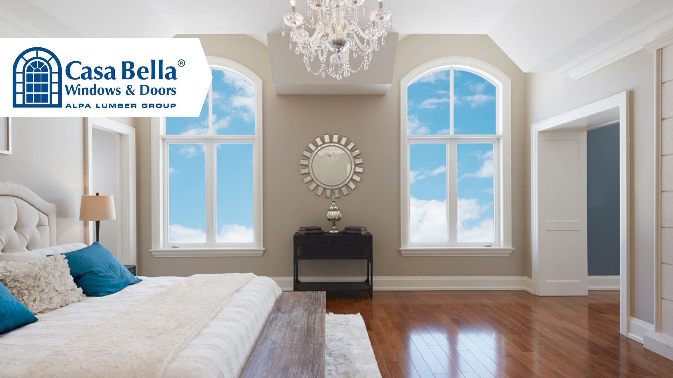 Elegant bedroom featuring Casa Bella’s double arched windows, flooding the room with natural light and offering a clear view of the blue sky, showcasing premium residential window installation.