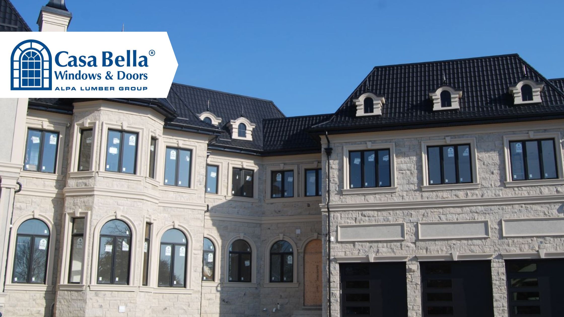 Custom luxury home featuring newly installed windows by Casa Bella Windows & Doors, illustrating what homeowners should consider before choosing new windows.
