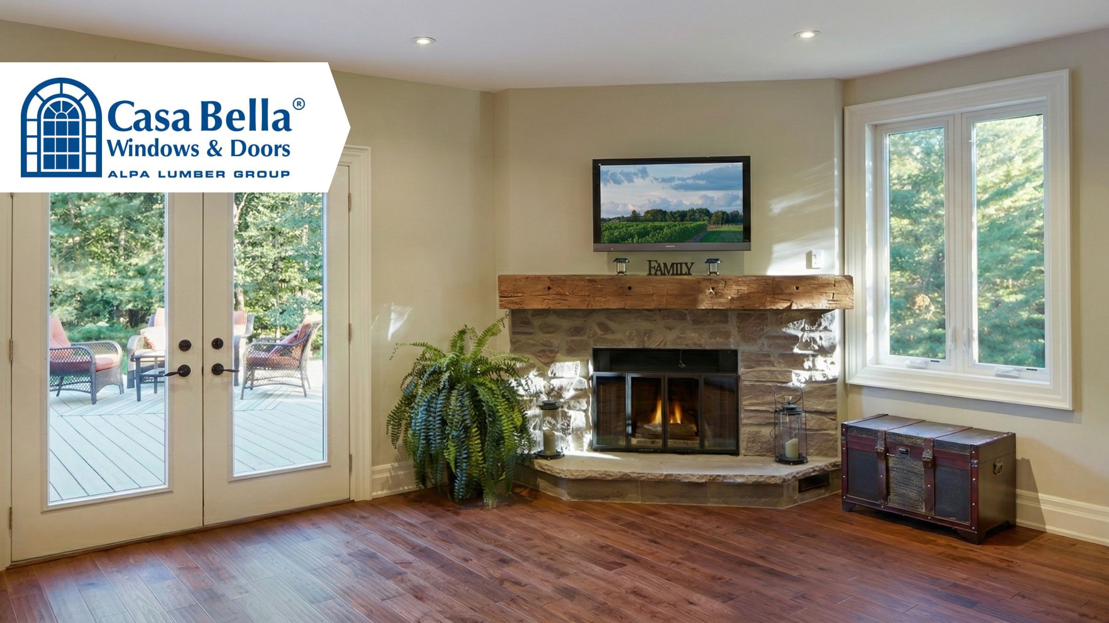 Bright living room featuring Casa Bella Windows & Doors with white French patio doors, large energy-efficient windows, and natural light highlighting a cozy fireplace interior